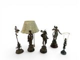 four figurines that are sitting next to each other