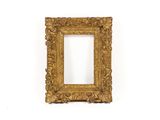 an old gold frame with a white background and a white wall