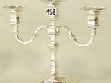 a silver candelab with a number on the top of it