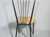an image of a chair with a seat made out of metal