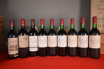 several bottles of wine are lined up on a table