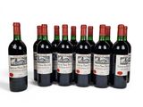 six bottles of red wine are lined up in a row