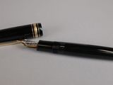 a pen that is laying on a table