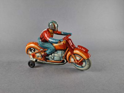 a figurine of a man riding a motorcycle