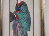 framed picture of a woman in a green kimono