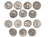 a close up of a bunch of silver coins on a white surface