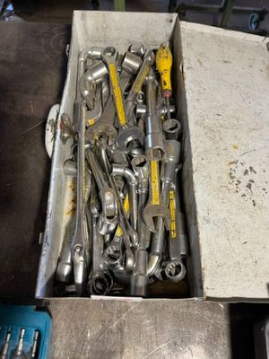 a box full of tools that are sitting on a table