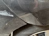 a close up of a car with a flat tire