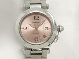 a close up of a wrist watch on a white surface