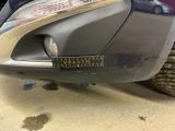 a close up of a car ' s bumper with a sticker on it