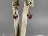 pair of earrings with amethorate and amethorate in gold