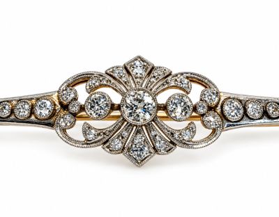 a close up of a diamond broochle on a white background