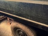 an image of a truck with a flat tire in the back of it