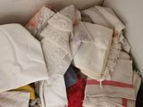 a pile of clothes in a box on the floor