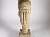 an image of a sculpture of a woman ' s head on a marble base