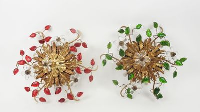 pair of gold and red flower brooches on white background