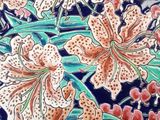 a decorative plate with flowers and dragonflies on it