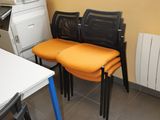 many chairs and a table in a room