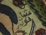 a close up of a plate with a painting on it