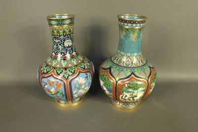 two vases sitting side by side on a table