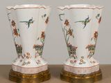 two vases that are sitting on a table