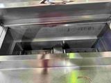 a picture of a machine that has some doughnuts in it