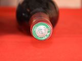 a close up of a bottle of wine on a table