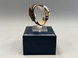 a close up of a watch on a display on a table