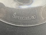 a close up of a glass plate on a table