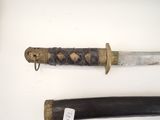 two different types of knives on display on a table