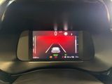 a picture of a car ' s rear view mirror with a red light on it