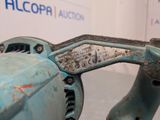 a blue machine that is sitting on a table