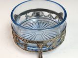 a glass bowl with a cross on it sitting on a table