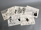 de nombreuses images de dessins animés sur la porte du réfrigérateur de cette cuisine