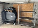 two shelves that are next to each other in a garage