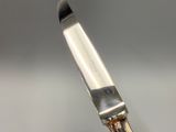 a knife that is sitting on top of a table