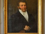 tableau représentant un homme en costume noir et chemise blanche