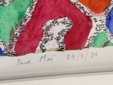 artwork on a white frame with a drawing of letters and numbers on it