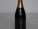 a bottle of champagne sitting on a marble table