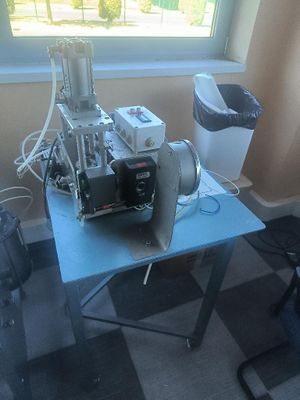 a machine that is sitting on a table by a window