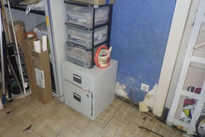 a refrigerator and freezer in the corner of a room