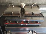 two grills that are sitting on top of each other