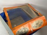 a box with a mirror inside of it on a table