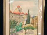 framed picture of a painting of a church with a red roof