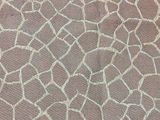 a giraffe pattern on the fabric on the floor