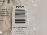 a bag of pieces of fabric on a white surface