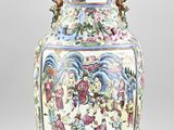 a large vase with a painting on it sitting on a table