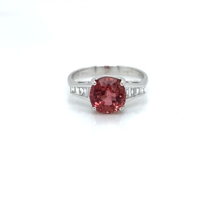 an image of a pink diamond ring with diamonds on the band