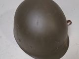 a helmet sitting on a table with a white background