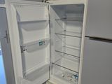an open refrigerator with its door open in a kitchen